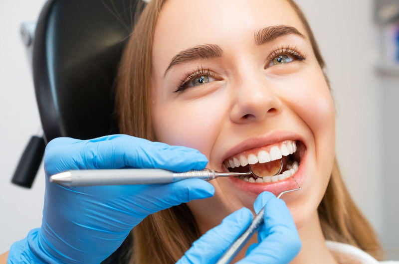 Patient receiving cosmetic dental treatment at a dental clinic