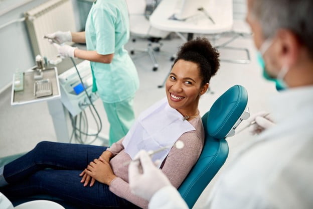 Patient discussing cosmetic dentistry treatment options with a dentist