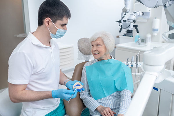 Dentist discussing dental implant treatment plan and cost during consultation in Markham.