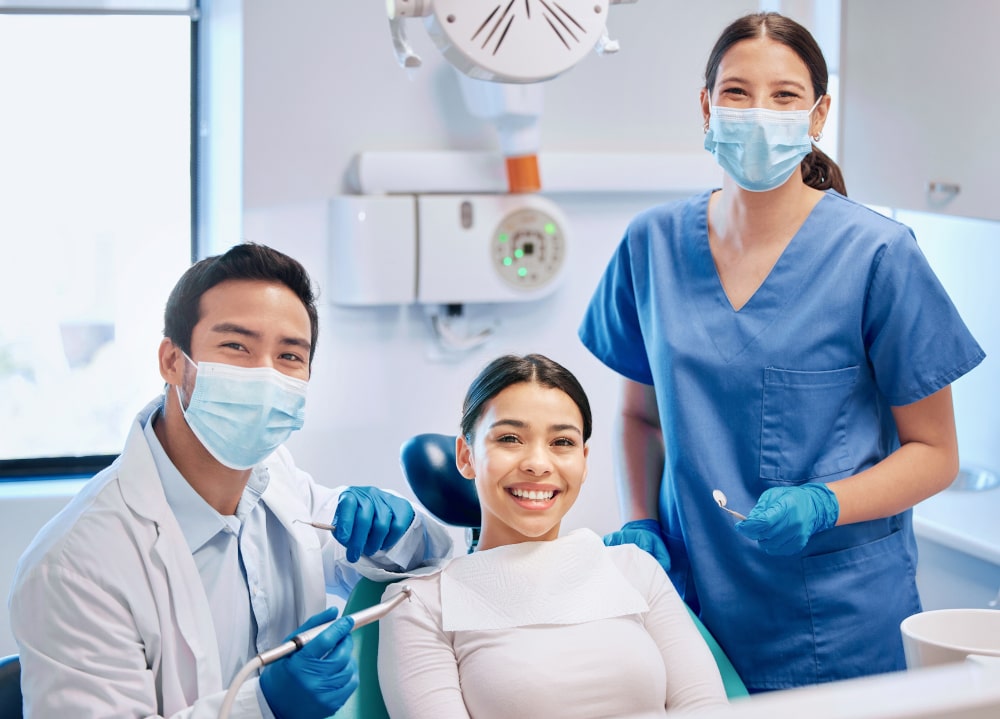 Young male dentist preparing to consult a patient about cosmetic dental care in Canada