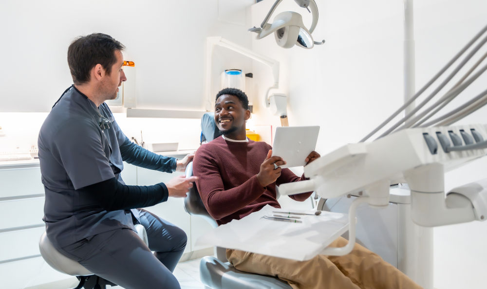 Dentist explaining sedation options to a patient at Markham Smile Centre before emergency treatment